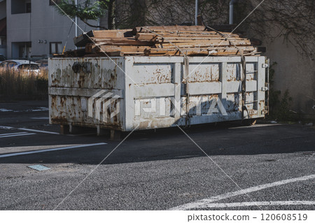 Containers loaded with waste wood from wooden demolition work 120608519