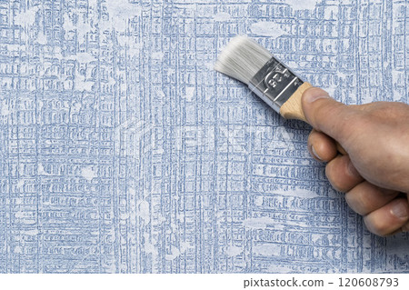 HandPainting a Beautifully Textured Blue Wallpaper Using a Brush for Adding Charm HandPainting a Beautifully Textured Blue Wallpaper Using a Brush for Adding Charm 120608793