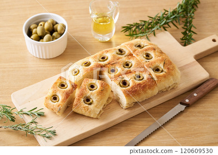 Focaccia baked with olives and rosemary Focaccia baked with olives and rosemary 120609530
