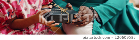 Exchanging Gift Box with Ribbons Between Two People Exchanging Gift Box with Ribbons Between Two People 120609583