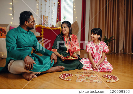 Celebrating Traditional Festival with Family Sitting Together 120609593