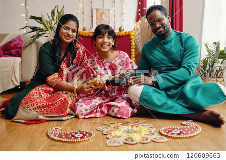 Celebrating Festival With Family In Decorated Room 120609663