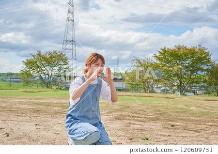 Nursery teachers playing in the park, countryside 120609731