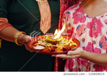 Celebrating Indian Festival with Traditional Rituals Celebrating Indian Festival with Traditional Rituals 120609814