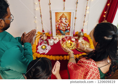 Participating in Ganesh Chaturthi Ceremony in Home Setting Participating in Ganesh Chaturthi Ceremony in Home Setting 120609819
