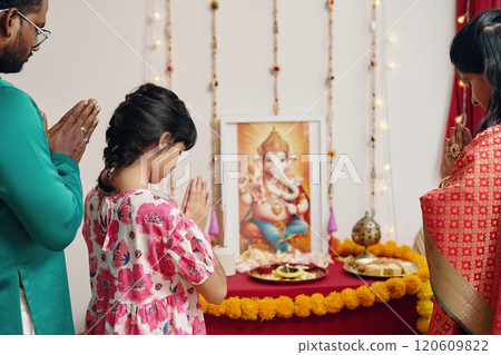 Worshipping Lord Ganesha During a Hindu Festival Worshipping Lord Ganesha During a Hindu Festival 120609822