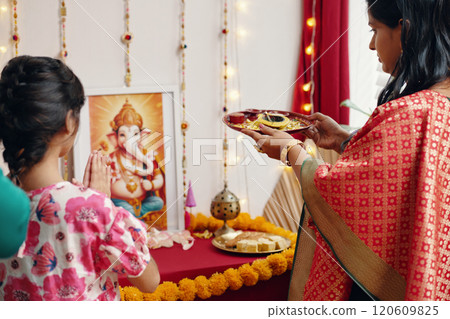 Celebrating Traditional Hindu Festival with Family Offerings Celebrating Traditional Hindu Festival with Family Offerings 120609825
