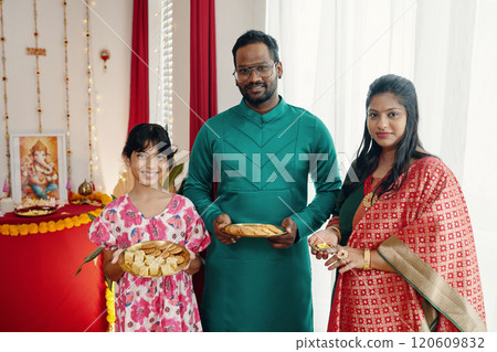 Family Celebrating Traditional Festive Occasion Together 120609832