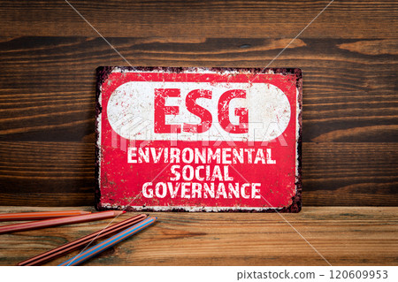 ESG environmental social governance. Metal sign with text on wood texture background 120609953