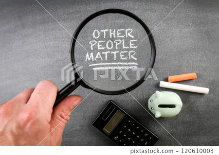 Other People Matter. Magnifying glass on black chalkboard background 120610003