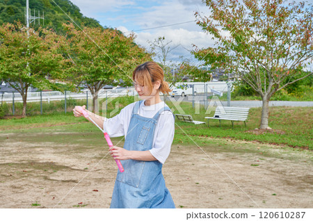 Nursery teachers playing in the park, countryside, soap bubbles 120610287