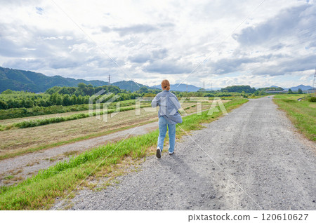 Field and woman, farmer, walk 120610627