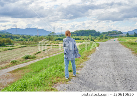Field and woman, farmer, walk 120610630