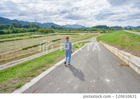 Field and woman, farmer, walk 120610631