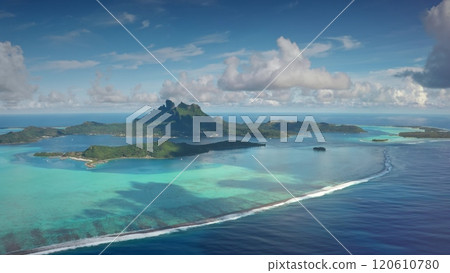 Aerial view Bora Bora island archipelago in French Polynesia. Turquoise lagoon coral reef barrier, mount Otemanu under blue sky. Remote wild nature paradise, exotic summer luxury travel. Drone flight Aerial view Bora Bora island archipelago in French Polynesia. Turquoise lagoon coral reef barrier, mount Otemanu under blue sky. Remote wild nature paradise, exotic summer luxury travel. Drone flight 120610780