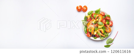 Healthy salad with grilled shrimps, avocado, cherry tomatoes and green leaves on white plate isolated on white background top view. Clean eating, nutrition and dieting concept, space for text. 120611616