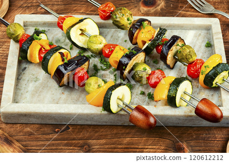 Grilled vegetable skewers on a plate. 120612212