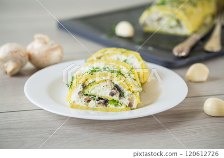 baked potato roll with cottage cheese filling with garlic and mushrooms, on a light wooden table baked potato roll with cottage cheese filling with garlic and mushrooms, on a light wooden table 120612726