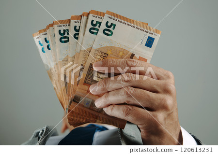 businessman has some euro banknotes in his hands businessman has some euro banknotes in his hands 120613231