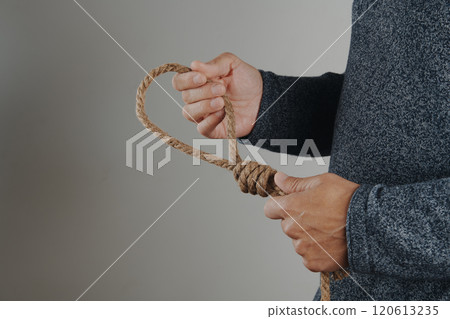 man holds a rope with a noose 120613235
