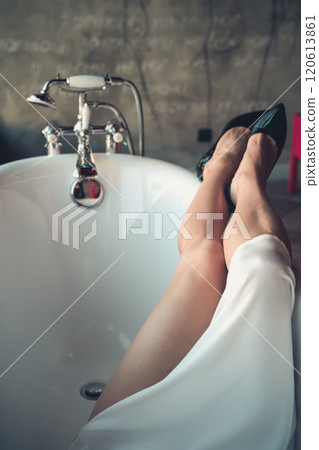 Woman feet high heels shoes in bathrobe at home, closeup Woman feet high heels shoes in bathrobe at home, closeup 120613861