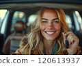 Caucasian woman showing car keys in hand sitting inside car in showroom. 120613937