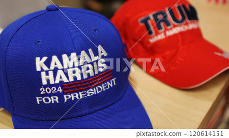 Kyiv, Ukraine - November 5, 2024: hats featuring "Kamala Harris 2024 For President" in blue and "Trump Make America Great Again" in red Kyiv, Ukraine - November 5, 2024: hats featuring "Kamala Harris 2024 For President" in blue and "Trump Make America Great Again" in red 120614151