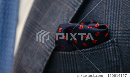 Navy blue pocket square elegantly tucked into the pocket of a plaid suit jacket Navy blue pocket square elegantly tucked into the pocket of a plaid suit jacket 120614157