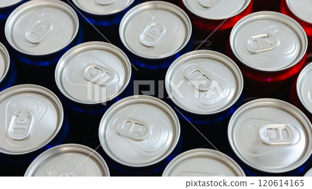 Overhead view of neatly arranged red and blue beverage cans with silver tops Overhead view of neatly arranged red and blue beverage cans with silver tops 120614165