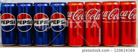 Kyiv, Ukraine - November 5, 2024: Close-up of neatly arranged Pepsi and Coca-Cola cans, showcasing a vibrant contrast of their iconic blue and red branding Kyiv, Ukraine - November 5, 2024: Close-up of neatly arranged Pepsi and Coca-Cola cans, showcasing a vibrant contrast of their iconic blue and red branding 120614169