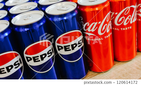 Kyiv, Ukraine - November 5, 2024: Close-up of neatly arranged Pepsi and Coca-Cola cans, showcasing a vibrant contrast of their iconic blue and red branding Kyiv, Ukraine - November 5, 2024: Close-up of neatly arranged Pepsi and Coca-Cola cans, showcasing a vibrant contrast of their iconic blue and red branding 120614172