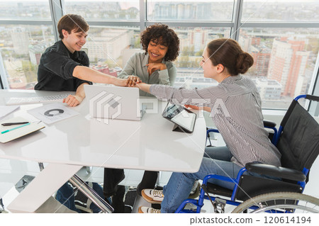 Stack of hands. Business startup teamwork unity concept. Top view of diverse multiracial business people putting hands together. Business colleagues during work process rejoice in success of company 120614194
