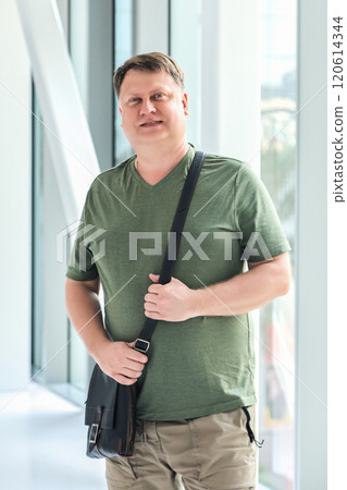 Portrait of mature handsome man in casual summer clothes in city life 120614344