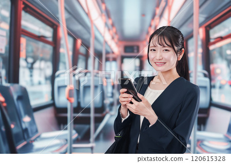Young woman commuting to work on the bus 120615328