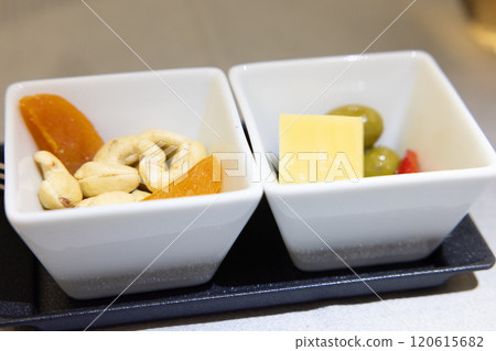 Nuts and other snacks served on business class flights Nuts and other snacks served on business class flights 120615682