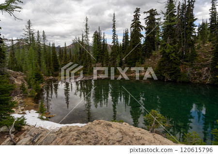 Snow-capped Mountains and Reflective Lake in a Stunning Alpine Landscape. 120615796