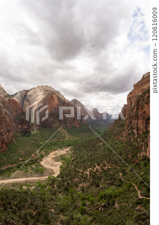 Majestic View of Zion National Park's Canyon, Lush Valley, and Dramatic Clouds. 120616009