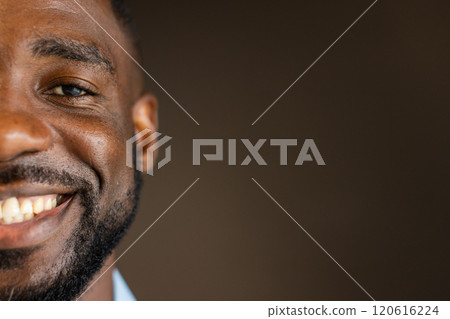 Smiling african american man, happiness and positivity, close-up of face with beard, copy space 120616224