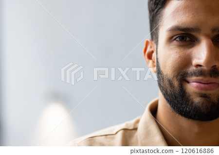 Smiling man with beard looking at camera, close-up portrait in studio, copy space Smiling man with beard looking at camera, close-up portrait in studio, copy space 120616886