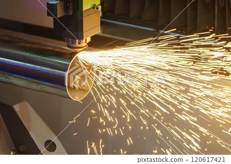 Close up scene the fiber laser cutting machine cut the stainless steel tube and sparkling light. Close up scene the fiber laser cutting machine cut the stainless steel tube and sparkling light. 120617421