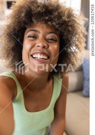 On video call, Smiling woman, at home On video call, Smiling woman, at home 120617458