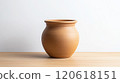 Artistic clay pot on wooden table: rustic home decor and craftsmanship 120618151