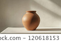 Close-up of a freshly shaped clay pot in natural light for art and craft design 120618153