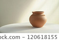Freshly shaped clay pot on display: embracing artisan craftsmanship and minimalist design 120618155