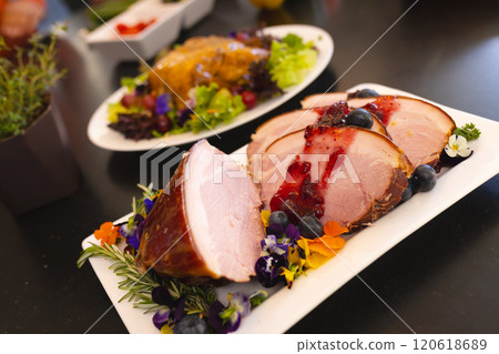Delicious meal prepared for christmas dinner, on table in sunny dining room Delicious meal prepared for christmas dinner, on table in sunny dining room 120618689