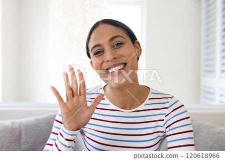 Portrait of happy biracial woman having video call at home Portrait of happy biracial woman having video call at home 120618966