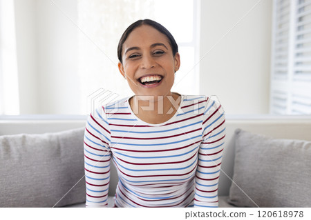 Portrait of happy biracial woman having video call at home Portrait of happy biracial woman having video call at home 120618978