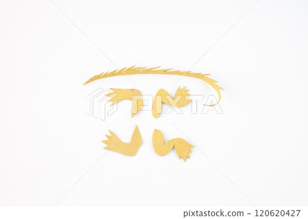 pieces of yellow paper cut into specific shapes. part of a craft project 120620427