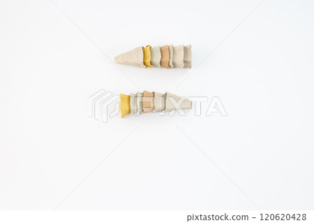 carton egg box cones slightly overlapping the next. The cones are in various colors, themes of recycling, sustainability, or creative use of materials 120620428