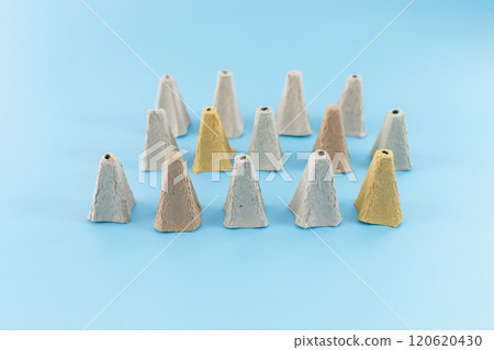 egg carton individual cone-shaped pieces are arranged in a row. egg carton components for crafting and recycle DIY project, egg carton individual cone-shaped pieces are arranged in a row. egg carton components for crafting and recycle DIY project, 120620430